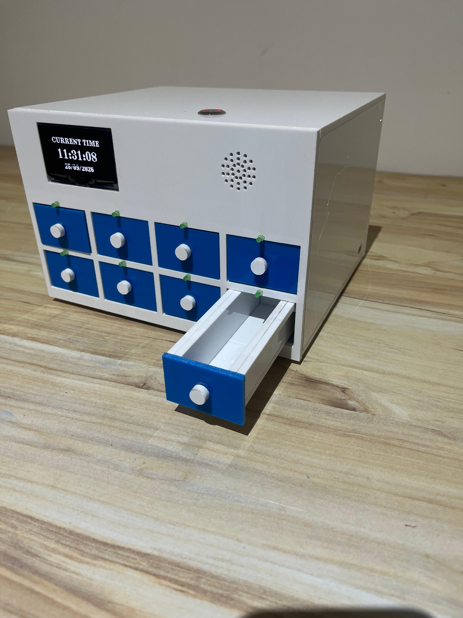 The working SmartMed prototype: eight drawers, OLED clock display, speaker and per-drawer LEDs.